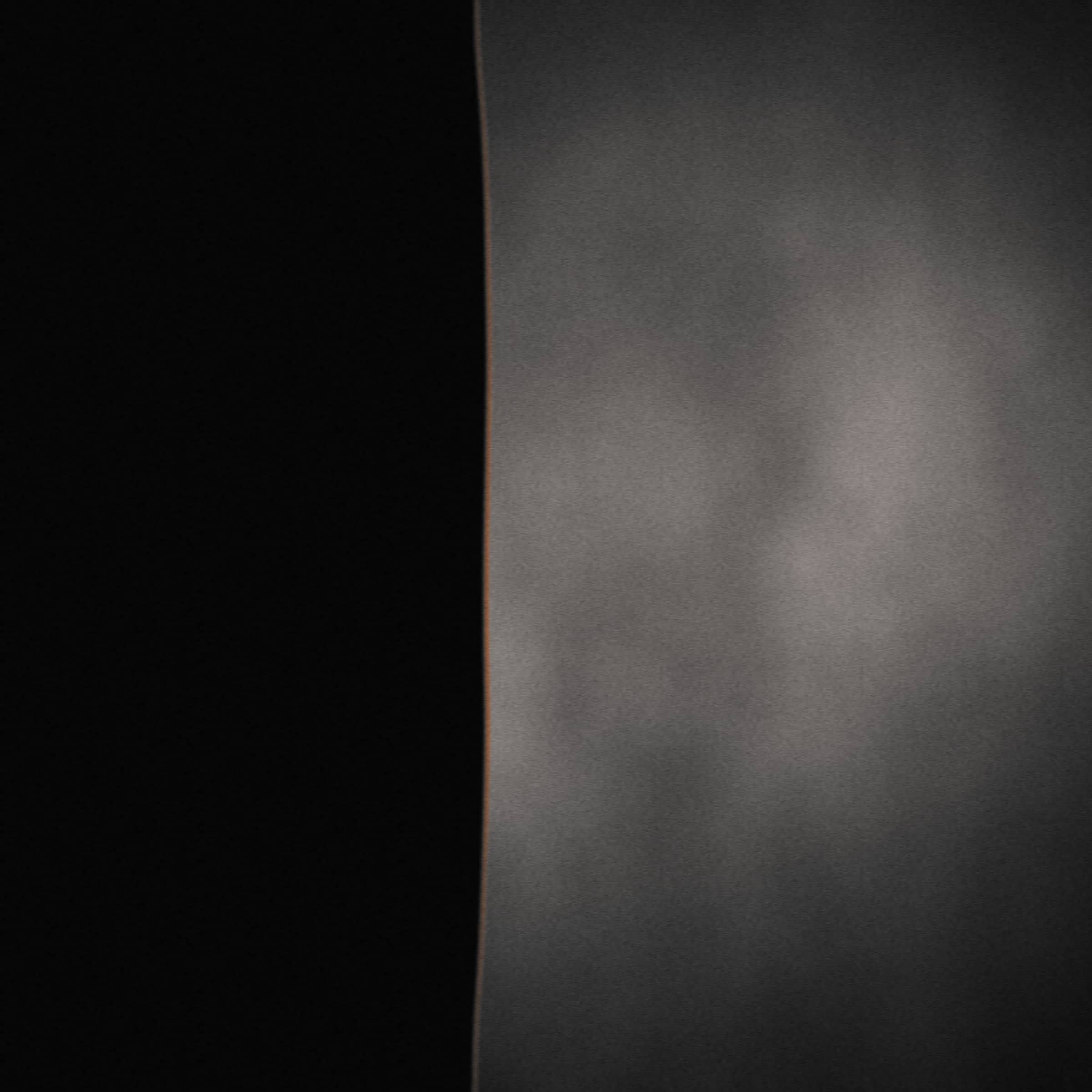 Placeholder press photo 03 — square crop, a hard edge of light across a surface.